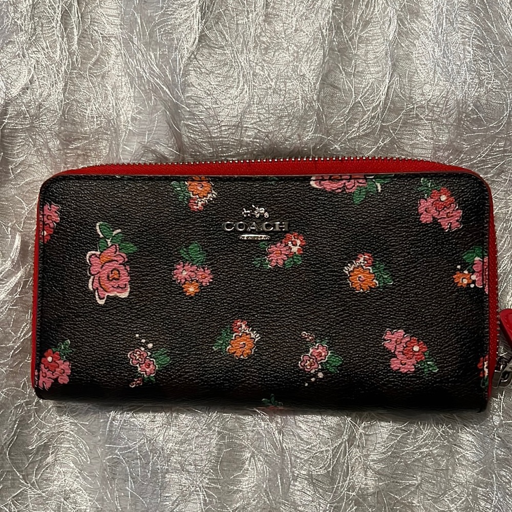 Multi brown and red floral coach wallet.